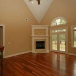 Great Room with ventless gas fireplace and rich hardwood flooring