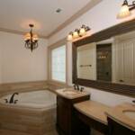 Master Bath with jetted tub, tiled shower, & double sink furniture style vanity