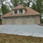 Detached 3 car garage in addition to attached 3 car garage.